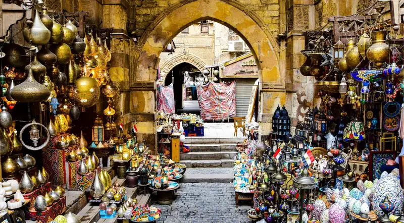 Brass lanterns and souvenirs hanging inside Khan El Khalili bazaar in Cairo
